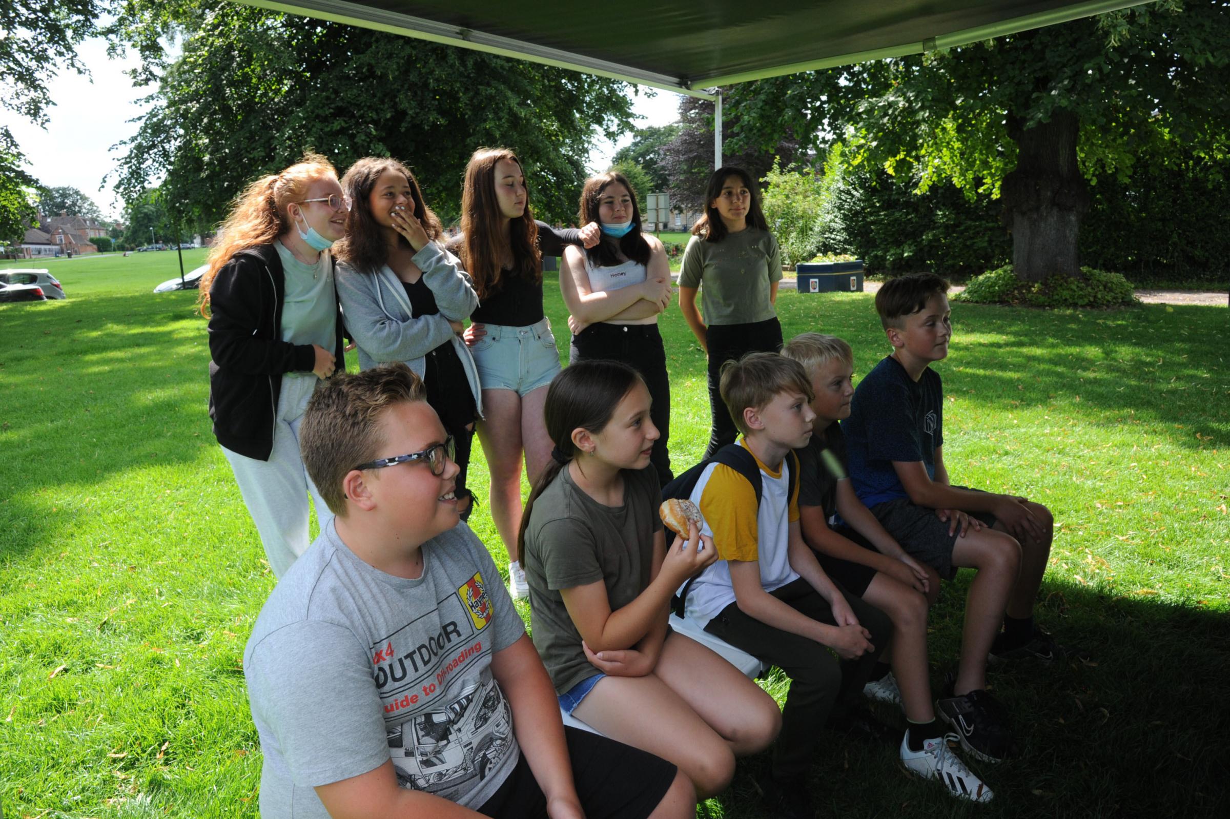 Popup Youth van Devizes Youngsters study the Wii golf game prior to playing at the pop up Youth van on the Green at Devizes 67543 2